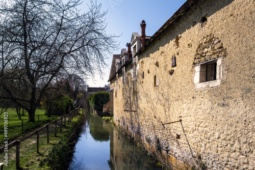 View of the river Indrois meandering behind the houses of Montrésor, Indre et Loire, France photo