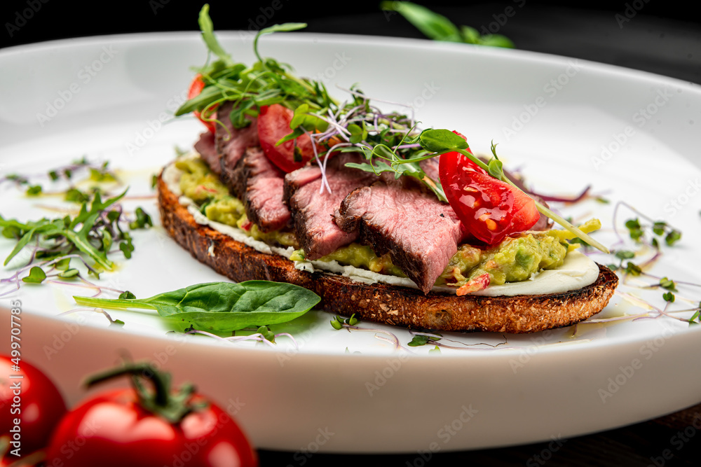 Bruschetta with tender beef, cream cheese and gluacomoli sauce Bruschetta with tender beef, cream cheese and gluacomoli sauce