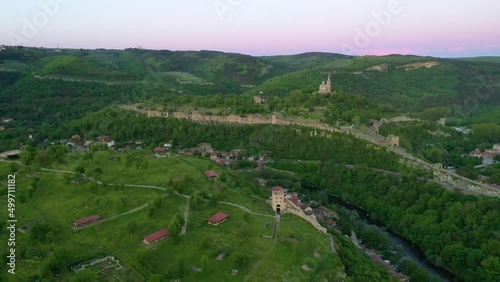 Sunset aerial view of Tsarevets and Trapezitsa fortresses in Veliko Tarnovo, Bulgaria photo