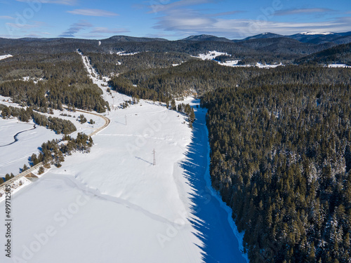 Aerial winter view of Beglika Reservoir covered with ice, Bulgaria photo