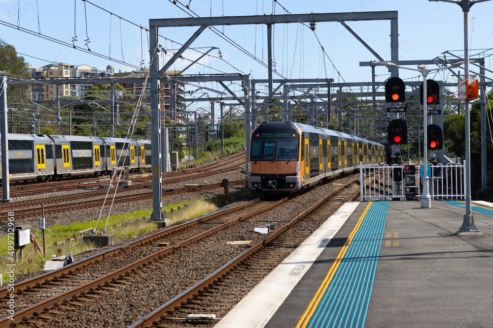 Obraz premium Commuter train approaching at a train station in Sydney NSW Australia blurred background