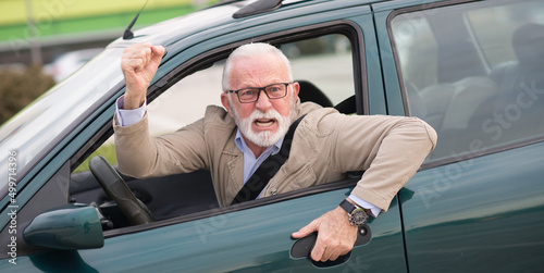 Angry senior man with bad eyesight driving car and getting into car accident
