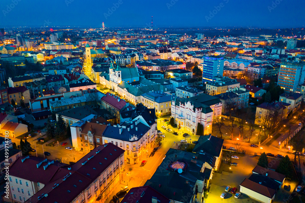 View from drone of lighted Rzeszow cityscape at spring twilight, Poland..