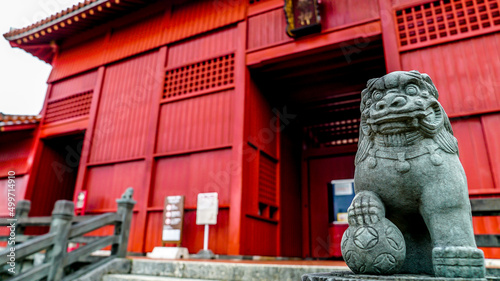 Lion statue at japanese temple shrine in okinawa japan religion travel adventure tropical island tourism god asian red building stone 