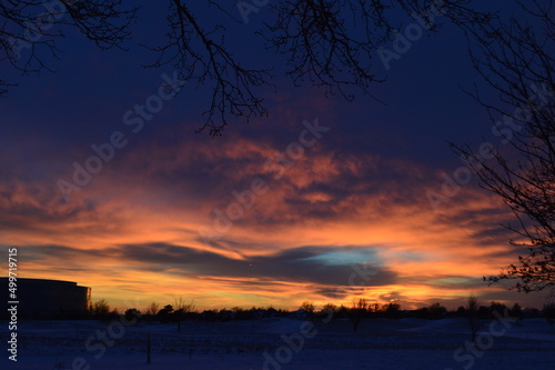 Punch hole cloud in altostratus cloud deck at sunset. Photo taken in Wichita.
