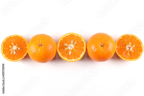 Flat lay decoration of fresh Orange slice fruits isolated over white background shoot photography in High angle view.