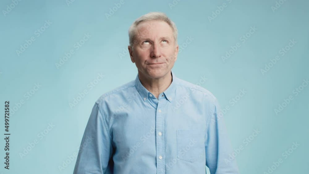 Fake information. Bored senior man rolling up eyes and frowning face, expressing tiredness and boredom, blue background