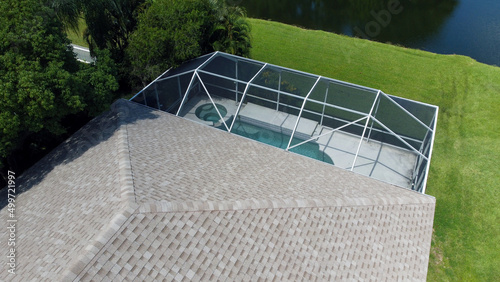 Bild auf Leinwand Aerial Drone Photo of  House Pool and Roof by Lake near Tampa Florida