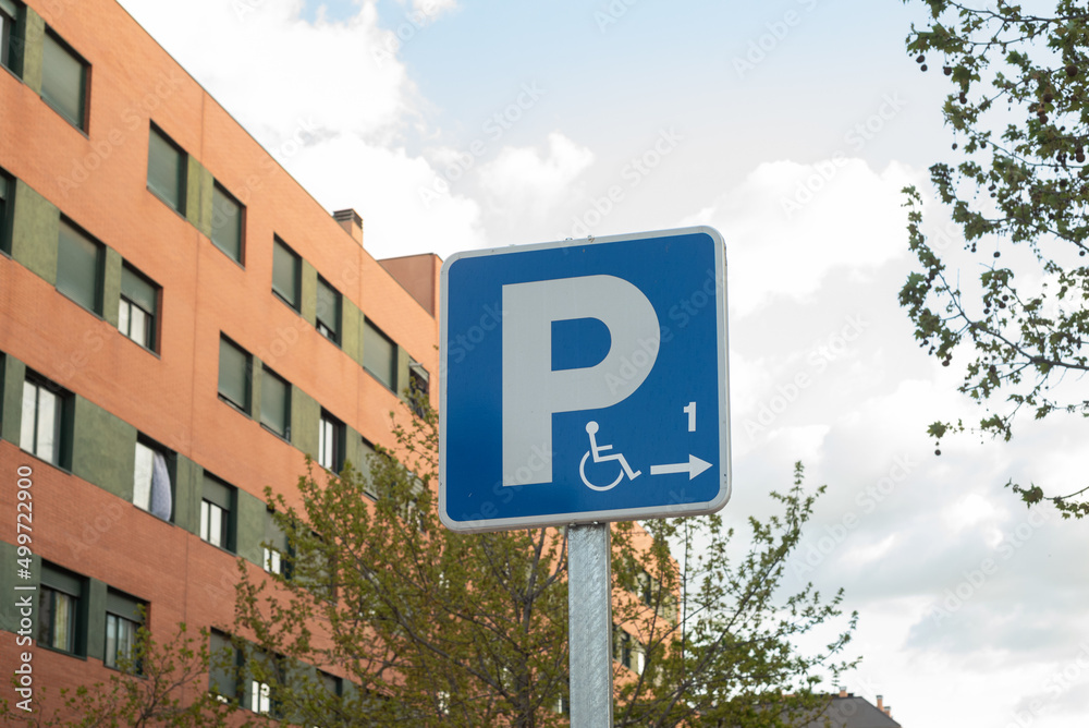 Fototapeta premium disabled parking sign outside street
