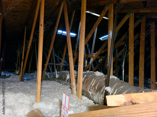 Attic / Crawlspace Under Roof With Insulation Foam and Rafters Taken During Florida Home Inspection