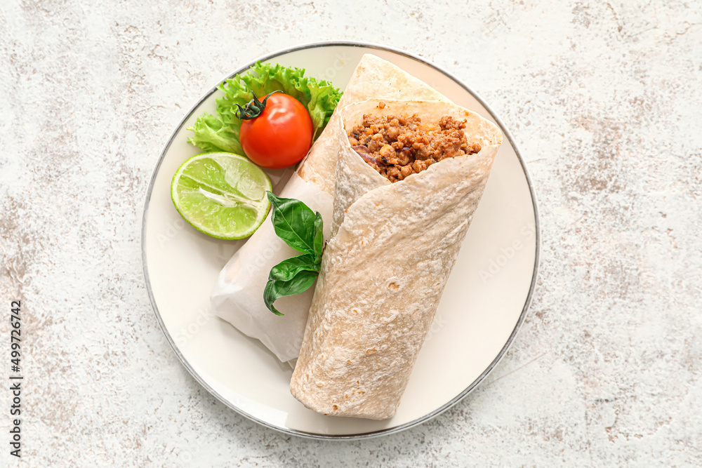 Plate with tasty burritos on light background Plate with tasty burritos on light background