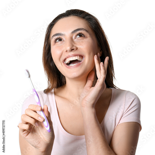 Happy young woman holding t...