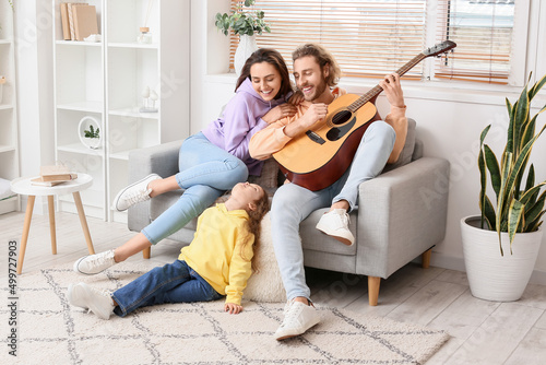 Happy young family playing ...