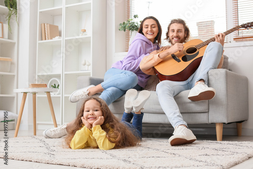Happy young family playing ...