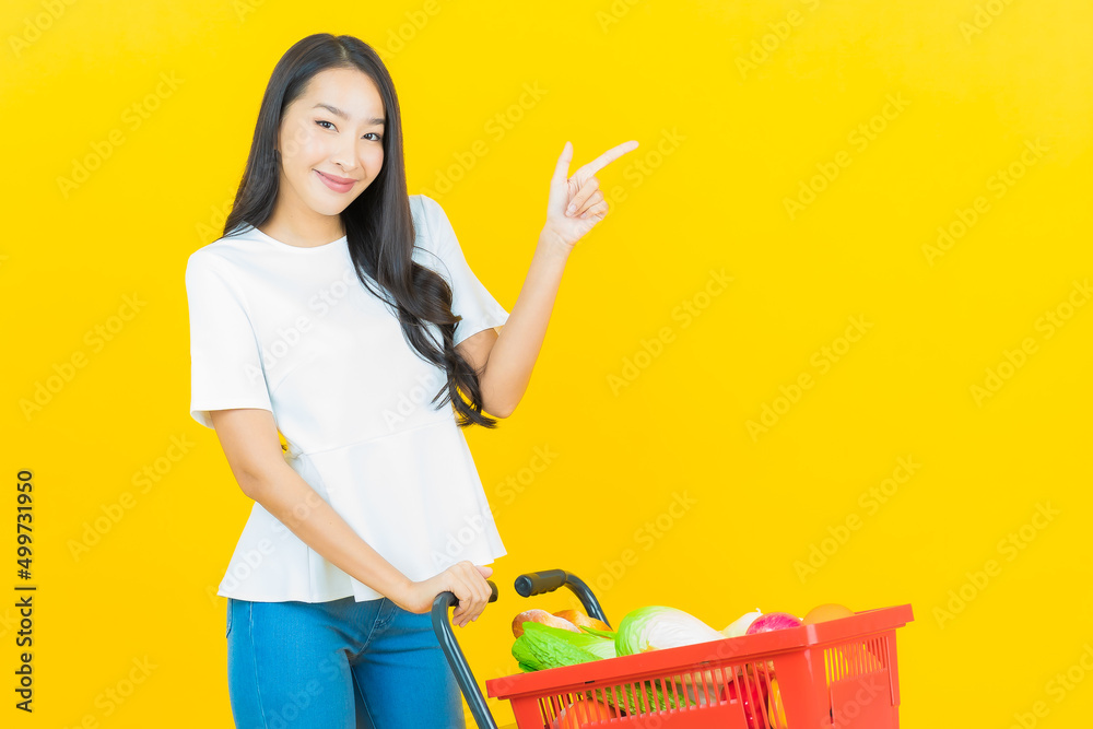 Portrait beautiful young asian woman smile with grocery basket Portrait beautiful young asian woman smile with grocery basket