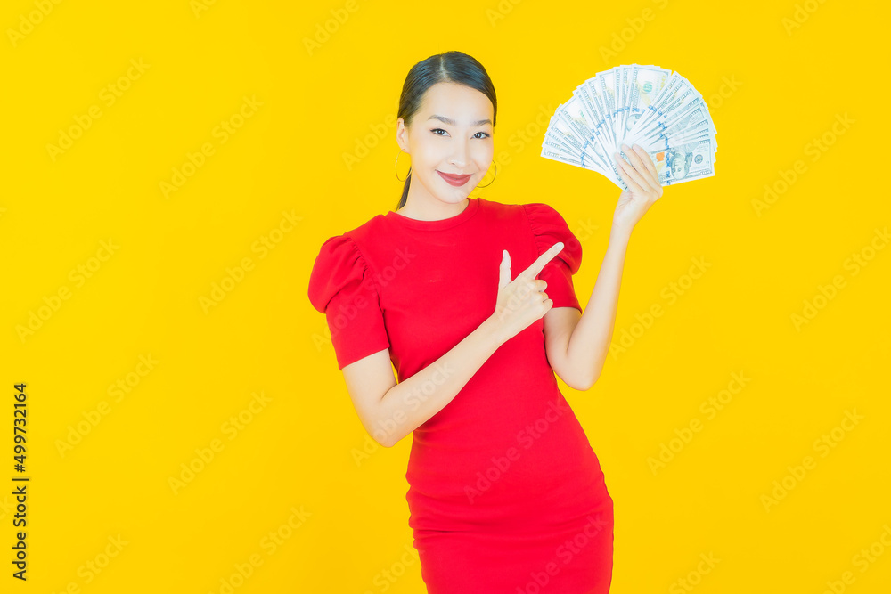 Portrait beautiful young asian woman smile with a lot of cash and money Portrait beautiful young asian woman smile with a lot of cash and money
