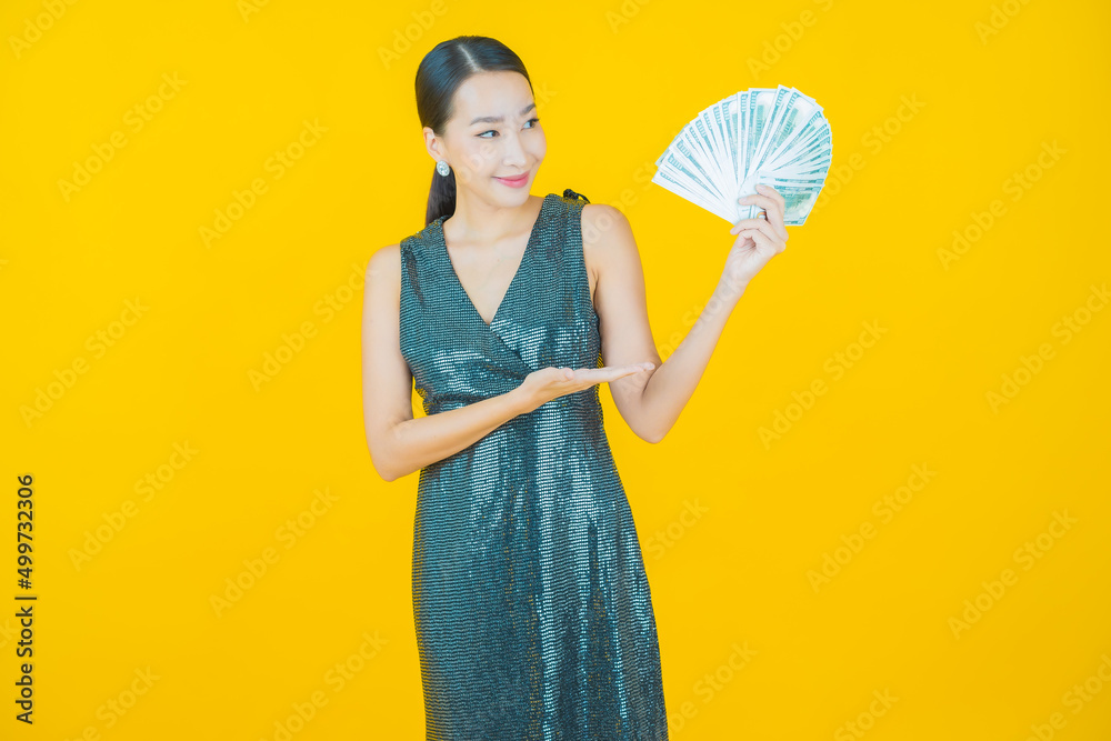 Portrait beautiful young asian woman smile with a lot of cash and money Portrait beautiful young asian woman smile with a lot of cash and money