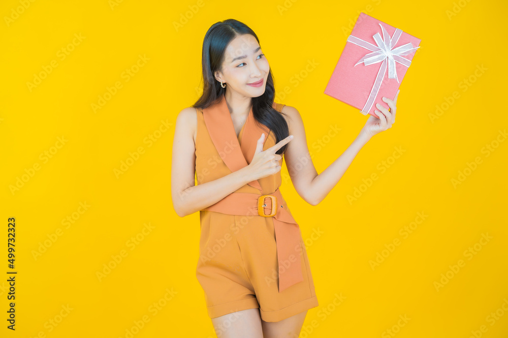 Portrait beautiful young asian woman smile with red gift box Portrait beautiful young asian woman smile with red gift box
