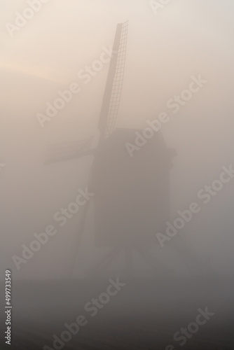 An Windmill in the fog photo