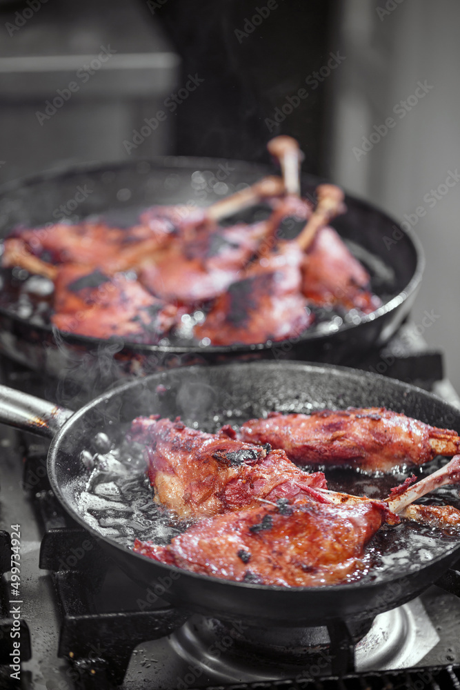 Goose drumstick frying in a pan Goose drumstick frying in a pan
