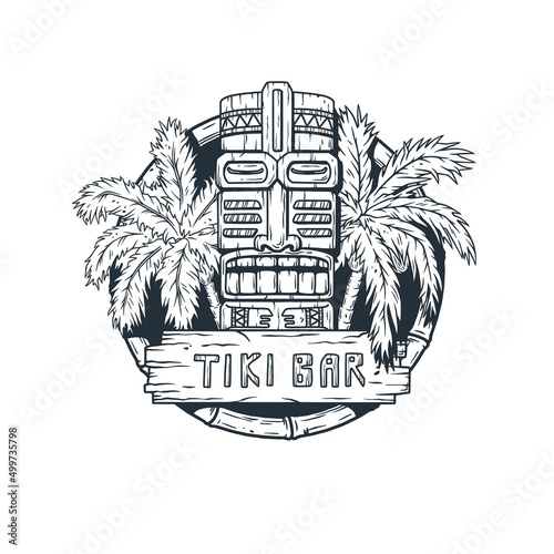 Tiki bar with tiki mask, wooden signboard and tropical leaves of palm for summer hawaii surfing and tropic exotic beach