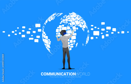 Silhouette businessman wear VR glasses with group of speech bubble icon shape to world map . concept of communication network in metaverse.