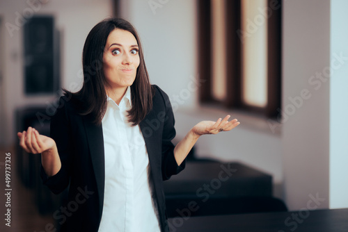 Undecided Teacher Standing in Front of an Empty Classroom  photo