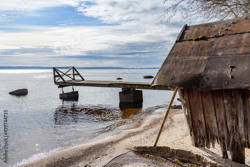 rotten boat house on lake vattern near habo in sweden photo