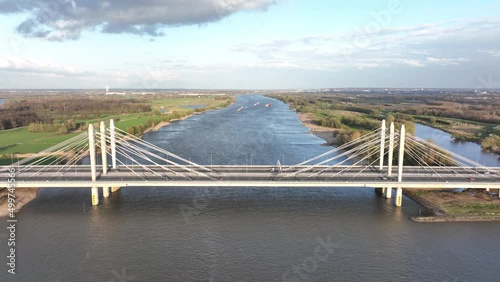 Road surface and traffic on Tacitusbrug bij Ewijk modern suspension bridge crossing the river Waal near Nijmegen, the Netherlands Holland Europe. Valburg and Ewijk. photo