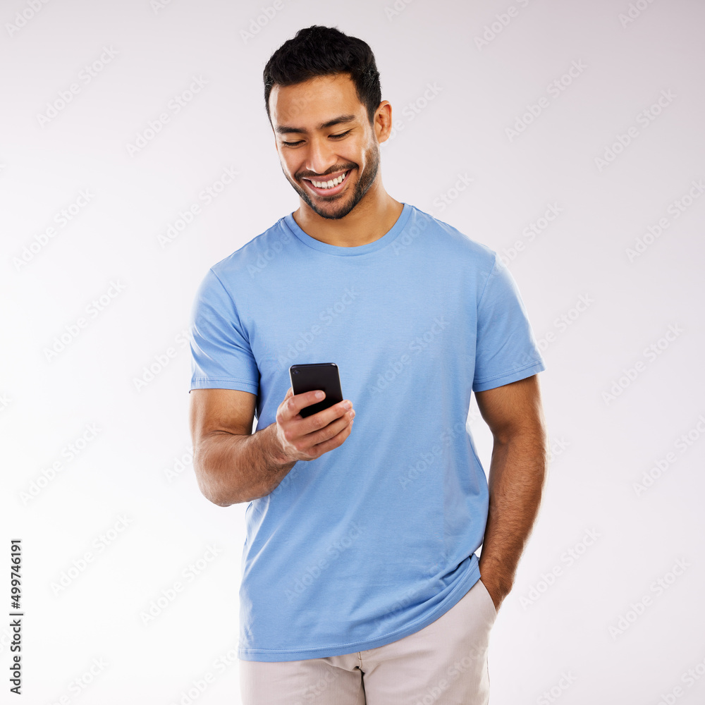 A sweet text a day keeps sadness away. Studio shot of a young man using a phone against a grey background. A sweet text a day keeps sadness away. Studio shot of a young man using a phone against a grey background.