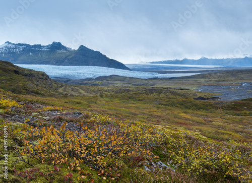 Beautiful autumn view from Mulagljufur Canyon to Fjallsarlon glacier with Breidarlon ice lagoon, Iceland. Not far from Ring Road and at the south end of Vatnajokull icecap and Oraefajokull volcano. photo