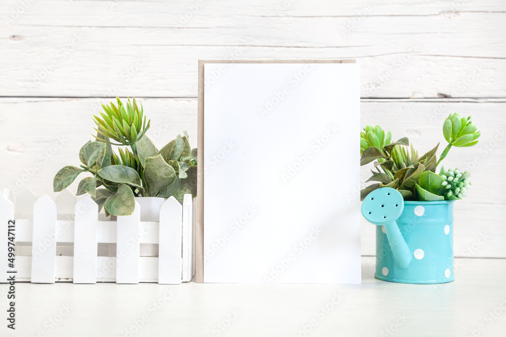 Fototapeta premium Party invitation mockup on a light background with flowers