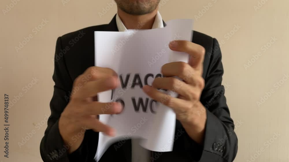 Frustrated asian male businessman professional crumpling paper with written message “NO VACCINE NO WORK” word. Man in suit and tie having nervous breakdown furiously throwing crumpled paper at work Frustrated asian male businessman professional crumpling paper with written message “NO VACCINE NO WORK” word. Man in suit and tie having nervous breakdown furiously throwing crumpled paper at work
