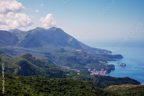 Panoramic view of the city of Budva, Montenegro. Beautiful view from the mountains to the Adriatic Sea. The time of the year is summer. © nazariykarkhut