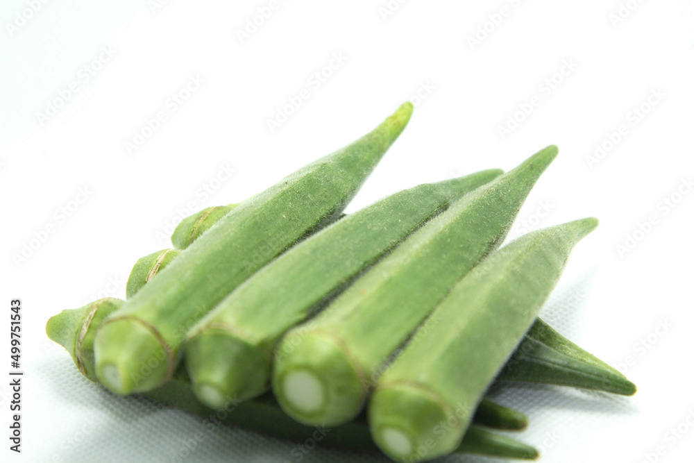 Okra is a healthy food that Japanese and Koreans and Europeans eat. and as herbs on white background isolated Okra is a healthy food that Japanese and Koreans and Europeans eat. and as herbs on white background isolated