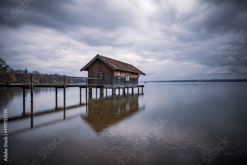 Traditional boathouse at lake Ammersee near Munich, Bavaria, Germany at sunrise. © CreativeImage