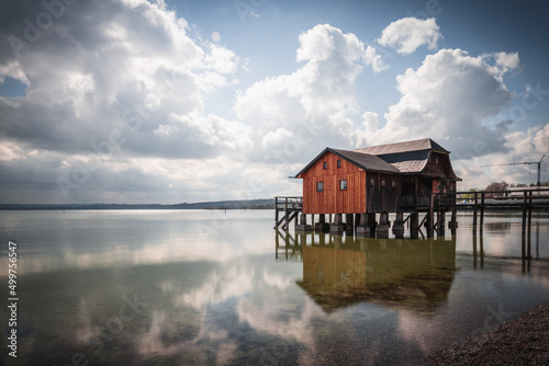 Fotobehang Traditional boathouse at lake Ammersee near Munich, Bavaria, Germany at sunrise