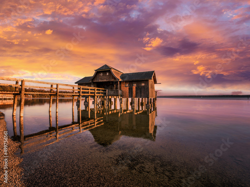Traditional boathouse at lake Ammersee near Munich, Bavaria, Germany at sunrise Fototapet