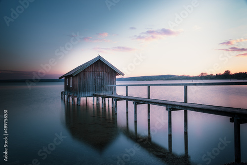 Traditional boathouse at lake Ammersee near Munich, Bavaria, Germany at sunrise. © CreativeImage