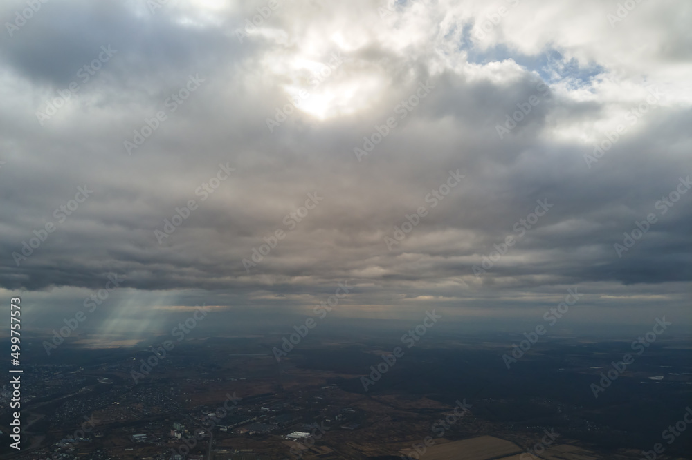 Aerial view from high altitude of earth covered with puffy rainy clouds forming before rainstorm