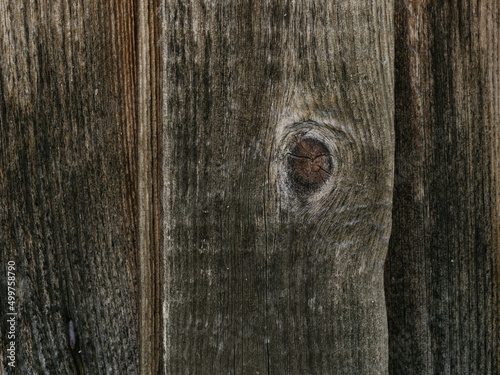 Large background texture of the wall of gray old wooden boards