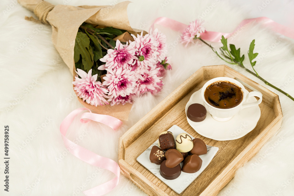 Bunch of flowers next to chocolate and Turkish coffee Bunch of flowers next to chocolate and Turkish coffee