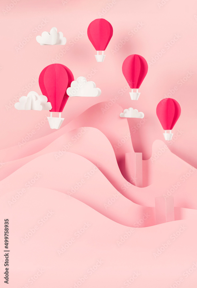 paper balloons and clouds on pink background