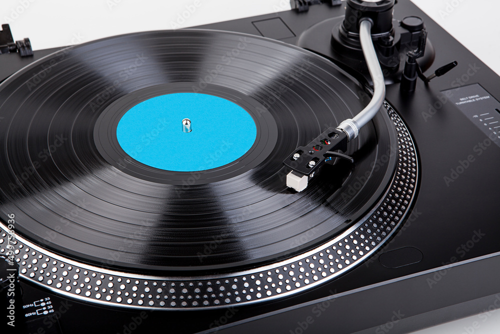 Classic and analog turntable for playing vinyl records. Model for a DJ Classic and analog turntable for playing vinyl records. Model for a DJ