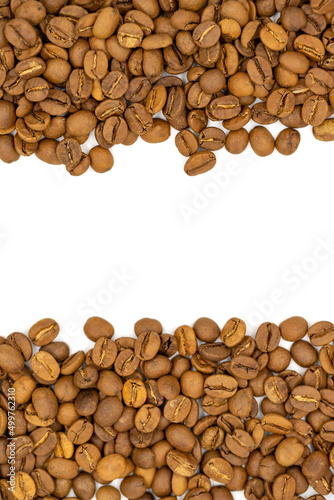 Coffee beans isolated on a white background. The middle is left blank as a text area. Close-up. Copy space. Empty space for text. Top view