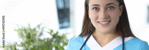 Portrait of smiling female doctor with stethoscope in medical clinic