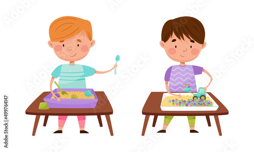 Creative kids playing Montessori educational games set. Cute little girl and boy standing at table playing with different objects and sand cartoon vector illustration