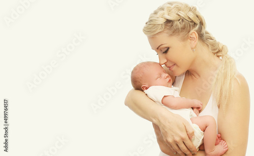 Baby sleeping on mother's hands on white background