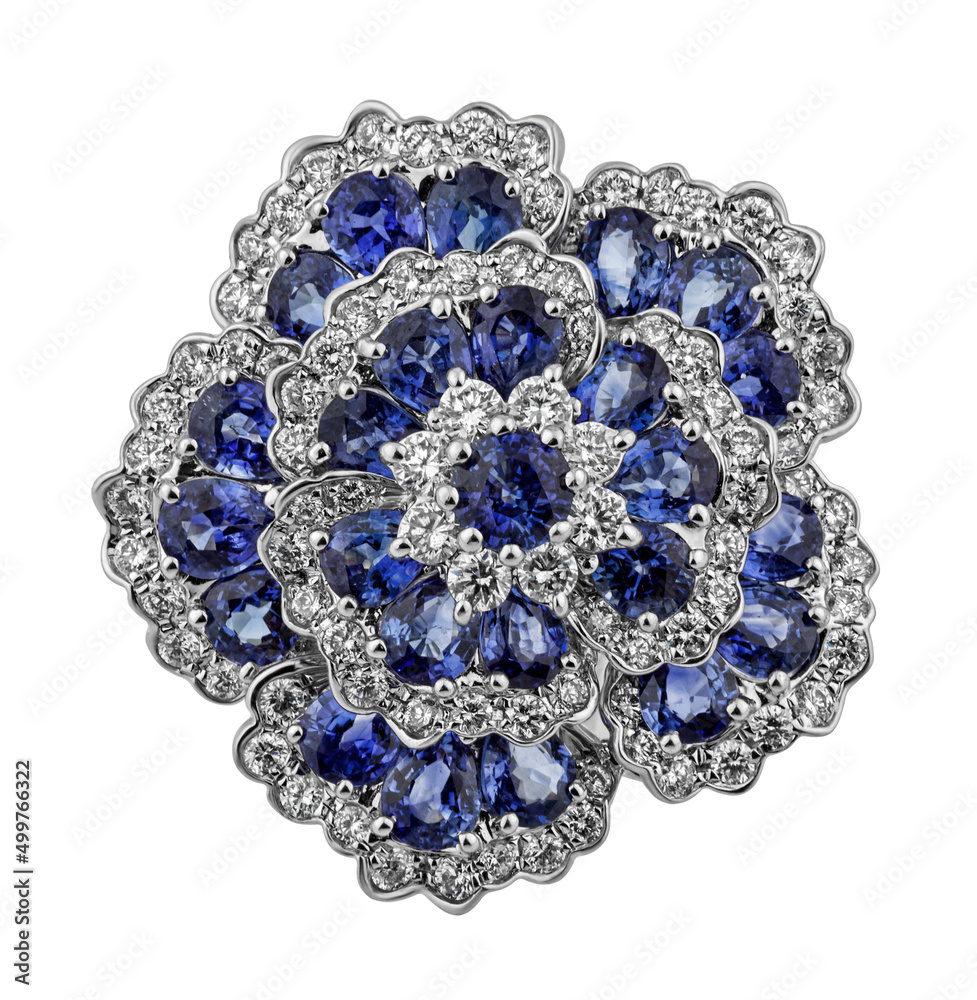 Diamond ring. Diamond ring isolated on white background. Ring with diamonds and sapphires. White gold. Golden flower with diamonds.
