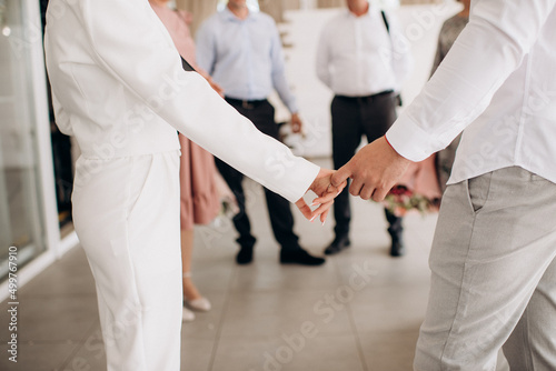 newlyweds in love holding hands